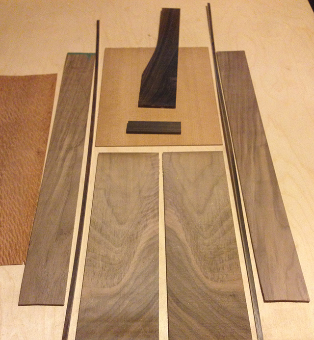 layout of various woods for custom build including walnut, spruce and rosewood